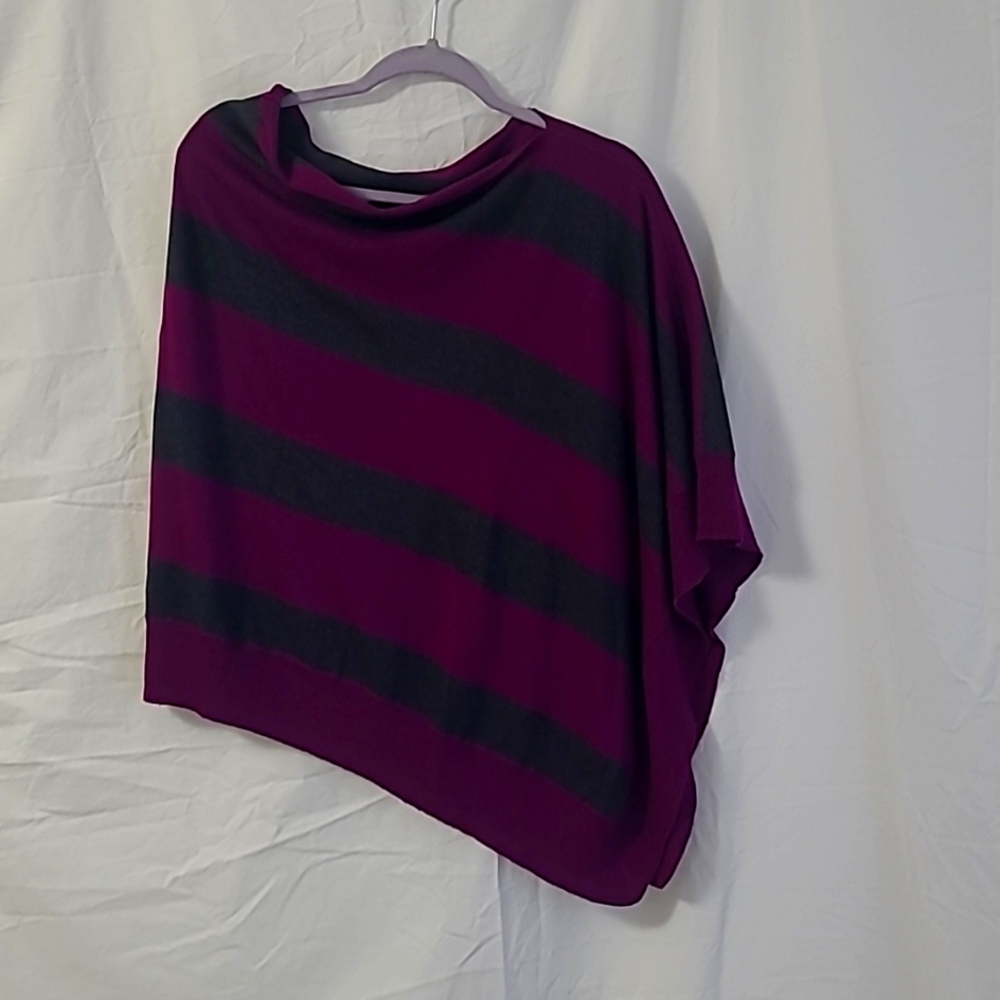 Kerisma A symmetrical poncho,  one size, magenta & gray striped.
